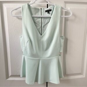 Dynamite light mint green peplum top with side cut outs